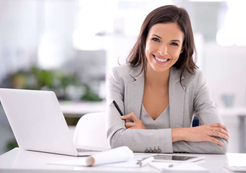 Smiling professional woman at a desk