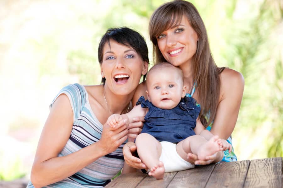 Two women and baby