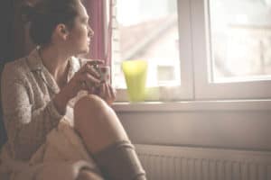 Woman looking out a window