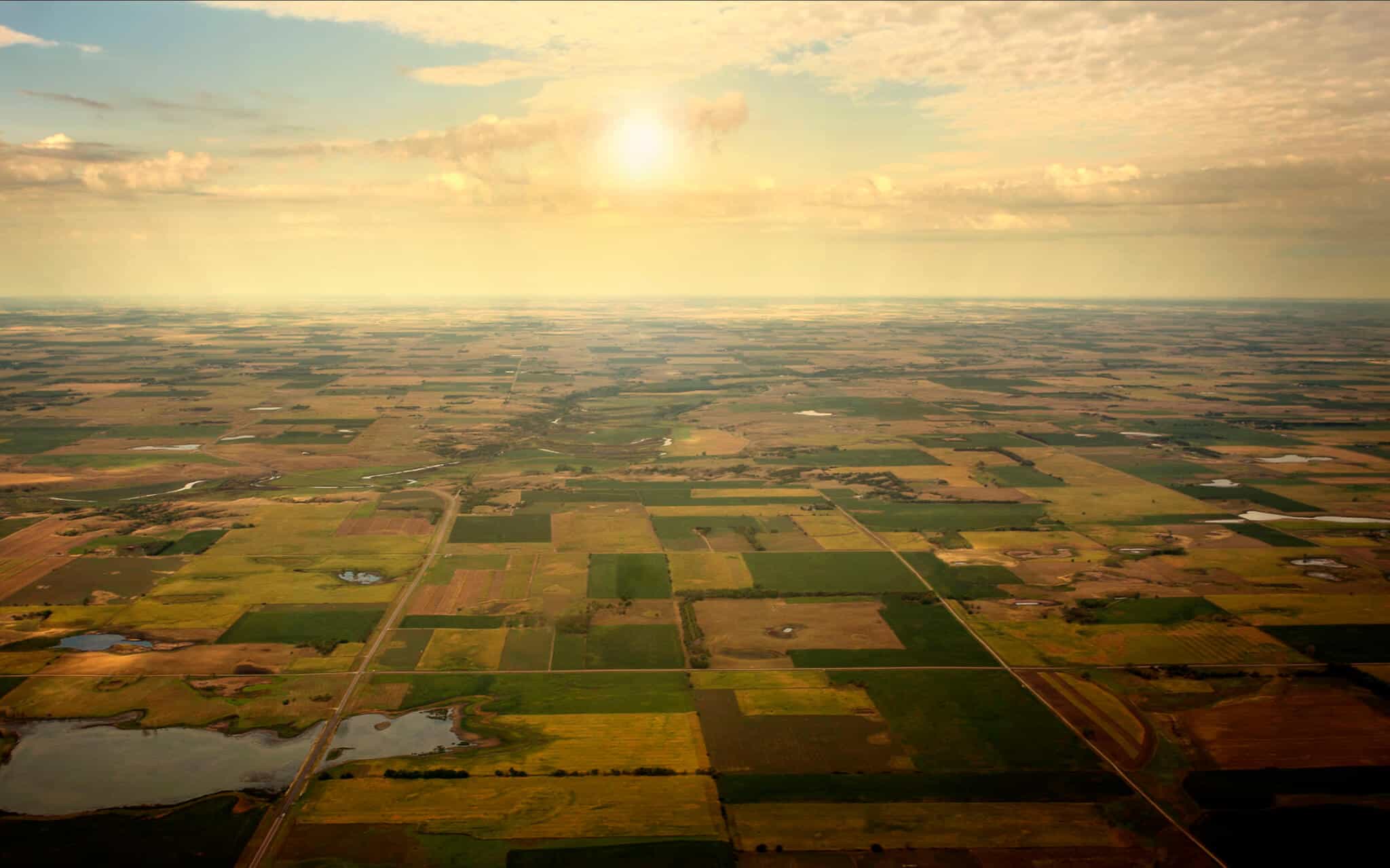 Sunrise on Horizon, aerial view of South Dakota Farm land.